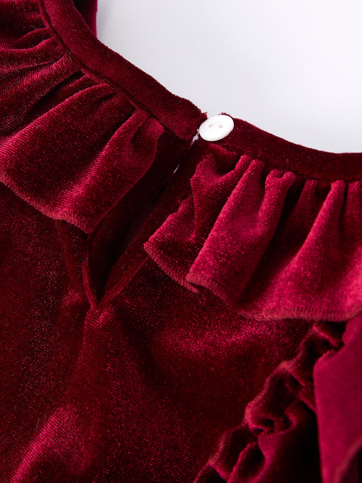 Girls velvet dress shoulder detail in burgundy with layered ruffle trim