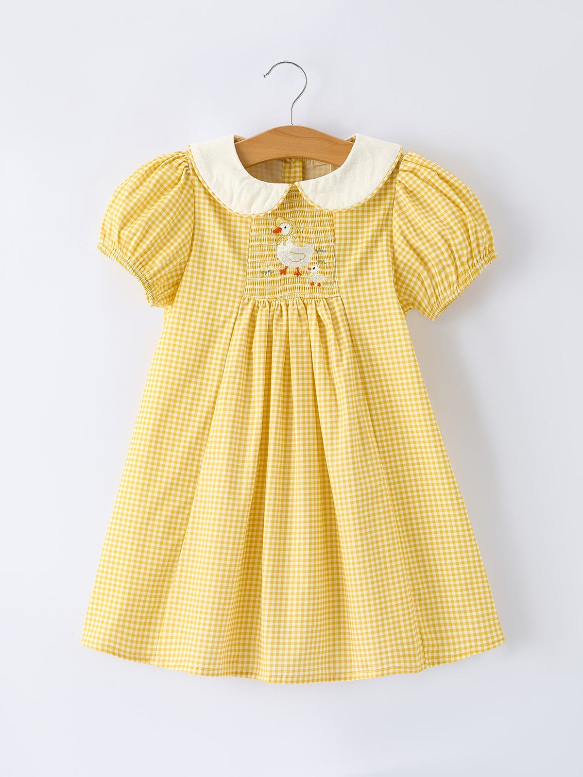 Yellow gingham smocked dress with embroidered goose and puff sleeves