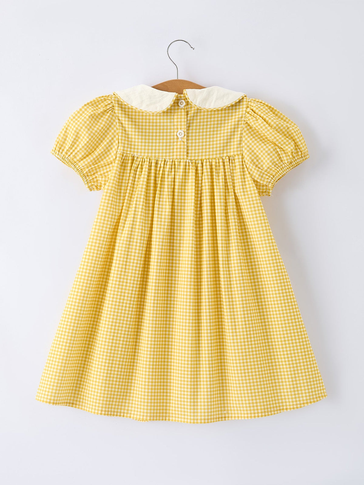Yellow gingham dress with smocked yoke and buttoned back