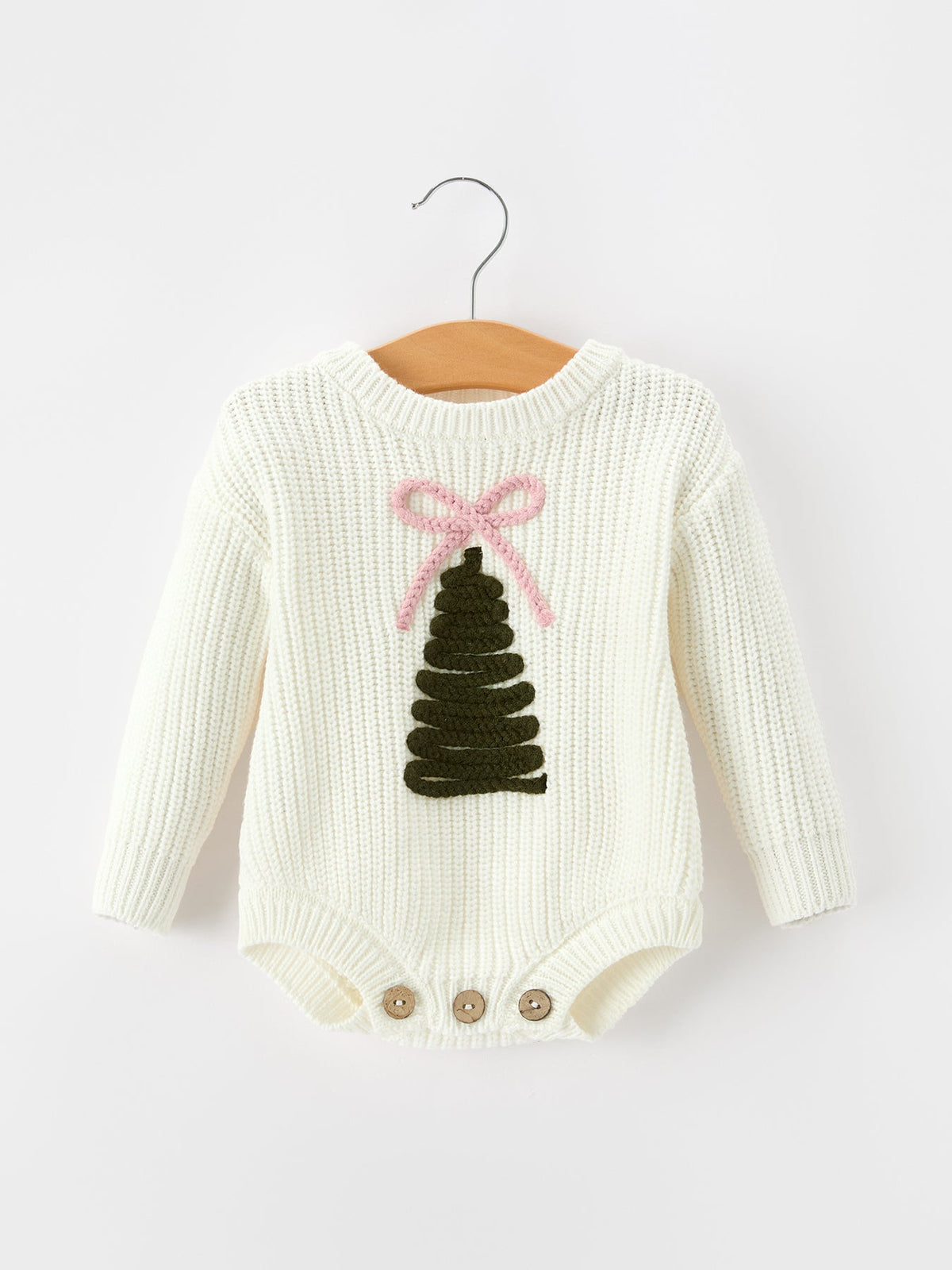 Girls cream knit romper with long sleeves, tree graphic and pink bow, button snaps