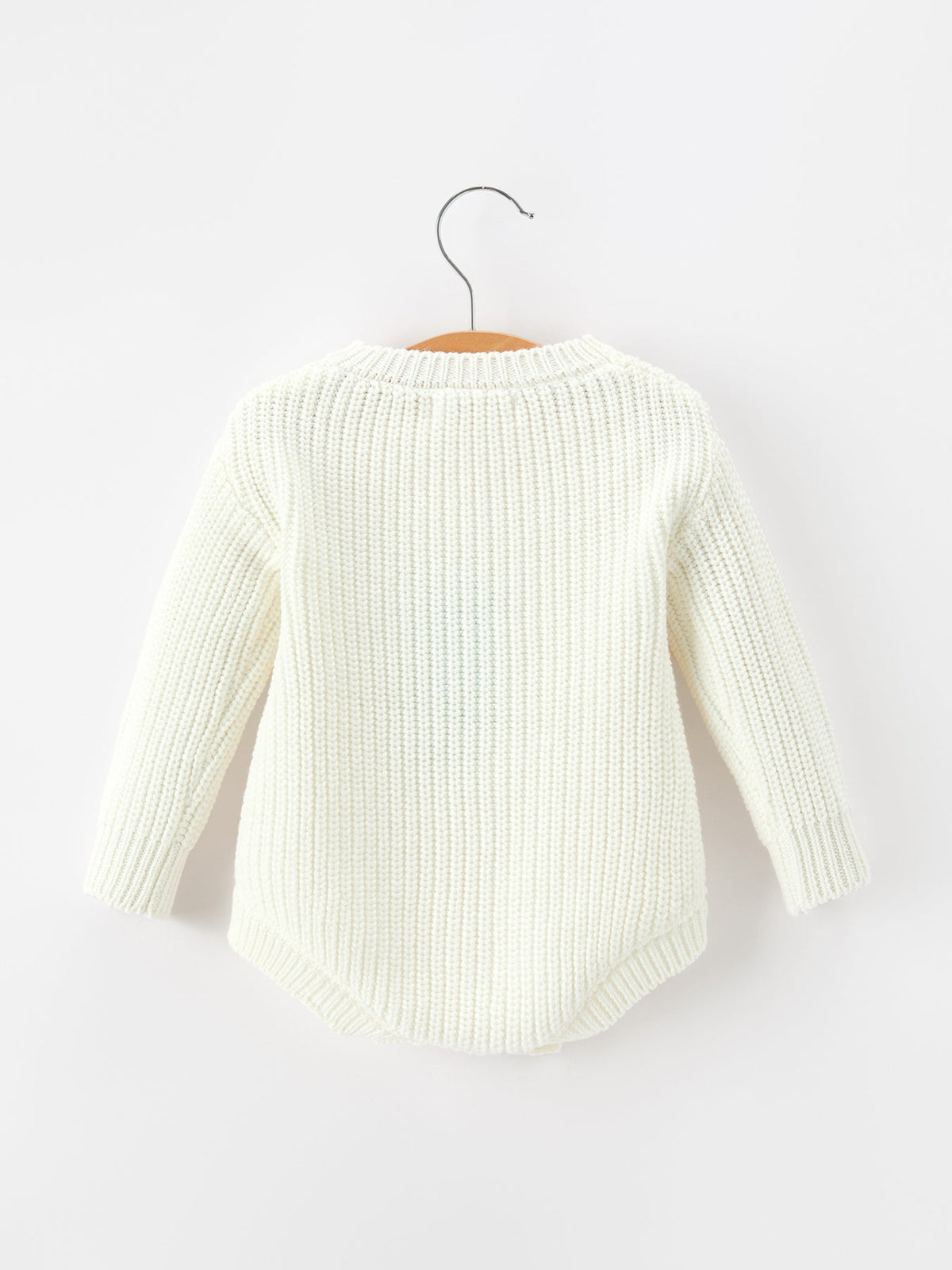 Girls cream knit romper with long sleeves, back view and ribbed cuffs