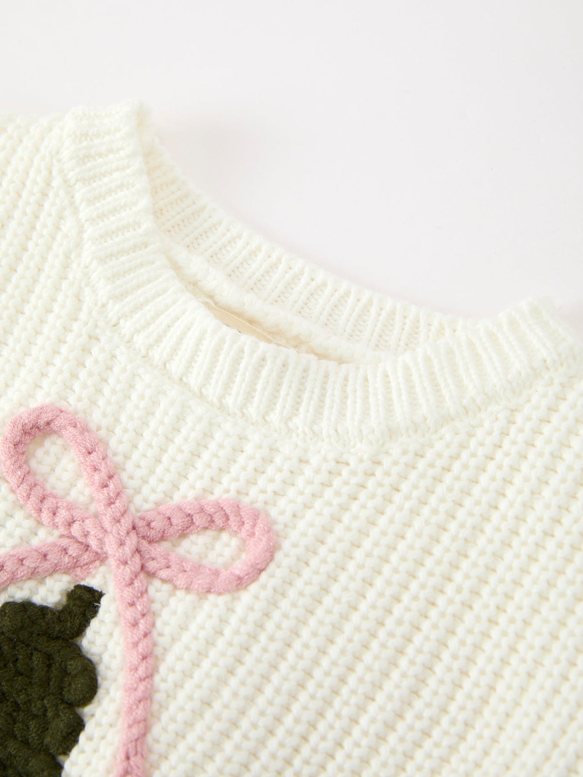 Girls cream knit romper neckline with pink bow and tree graphic detail