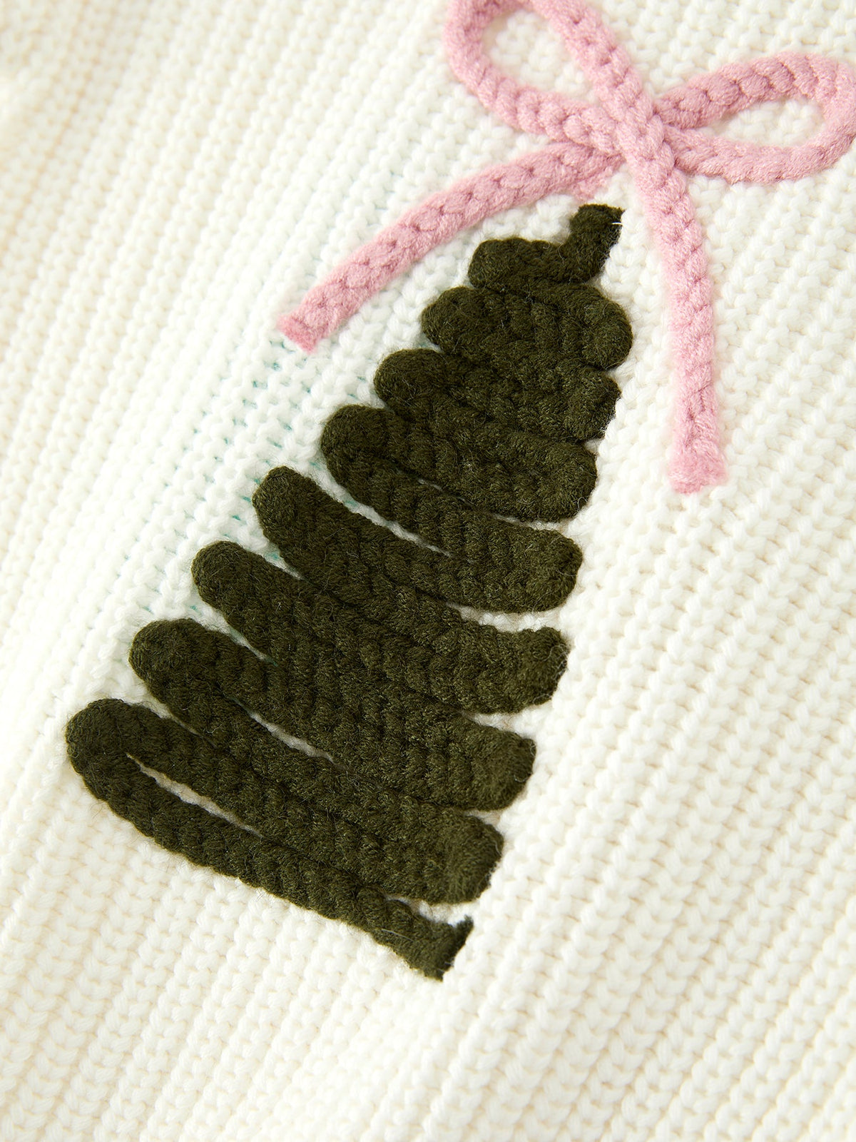 Cream knit romper front with dark green Christmas tree applique and pink bow