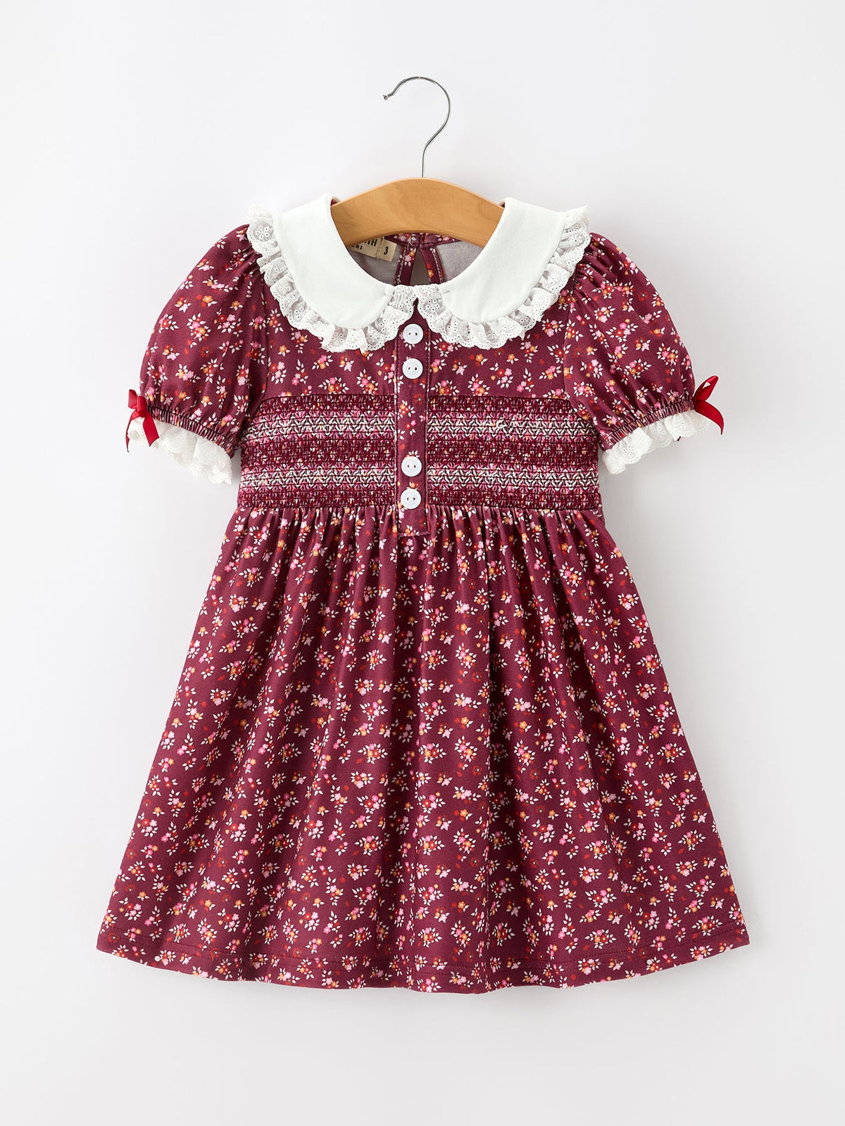 Burgundy floral girls dress with peter pan collar, lace trim, and front buttons
