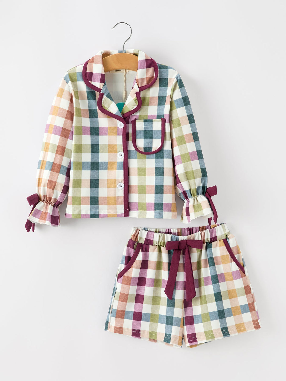 Plaid mom-and-child pajama set on hangers: button top with pocket and drawstring shorts