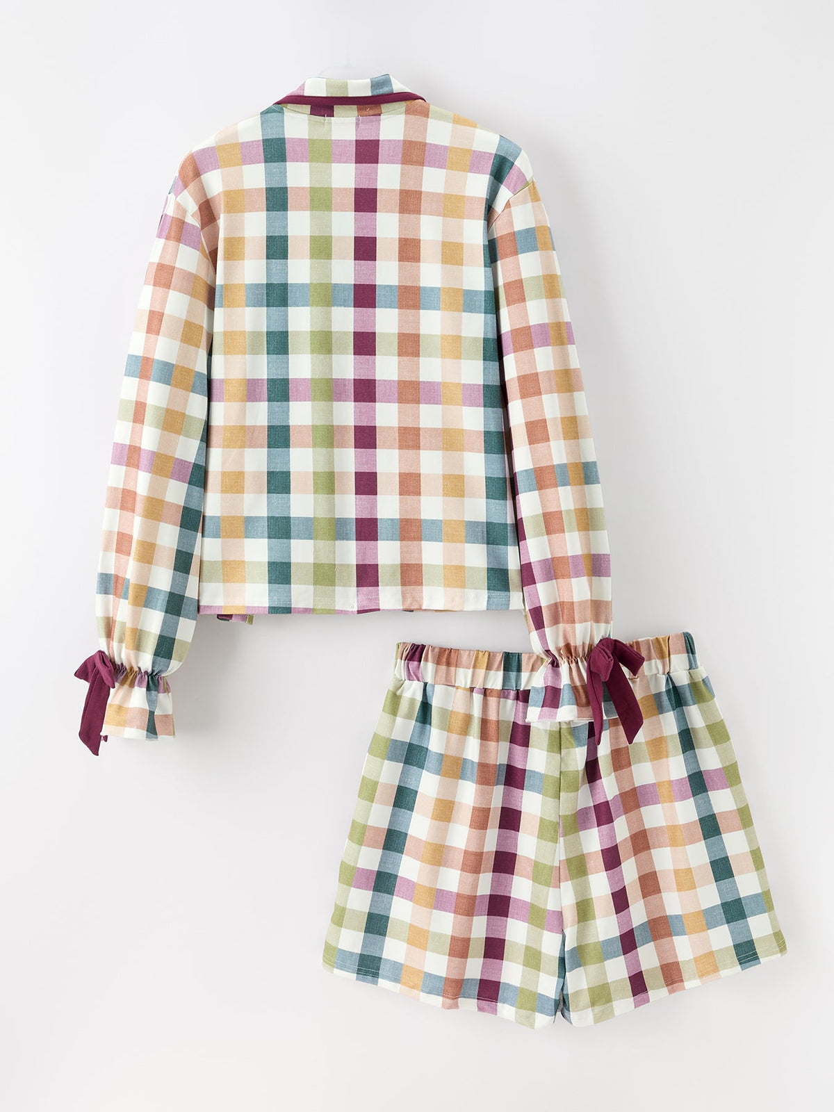 Multicolor plaid pajama set with maroon trim; long sleeves and gathered shorts, front view