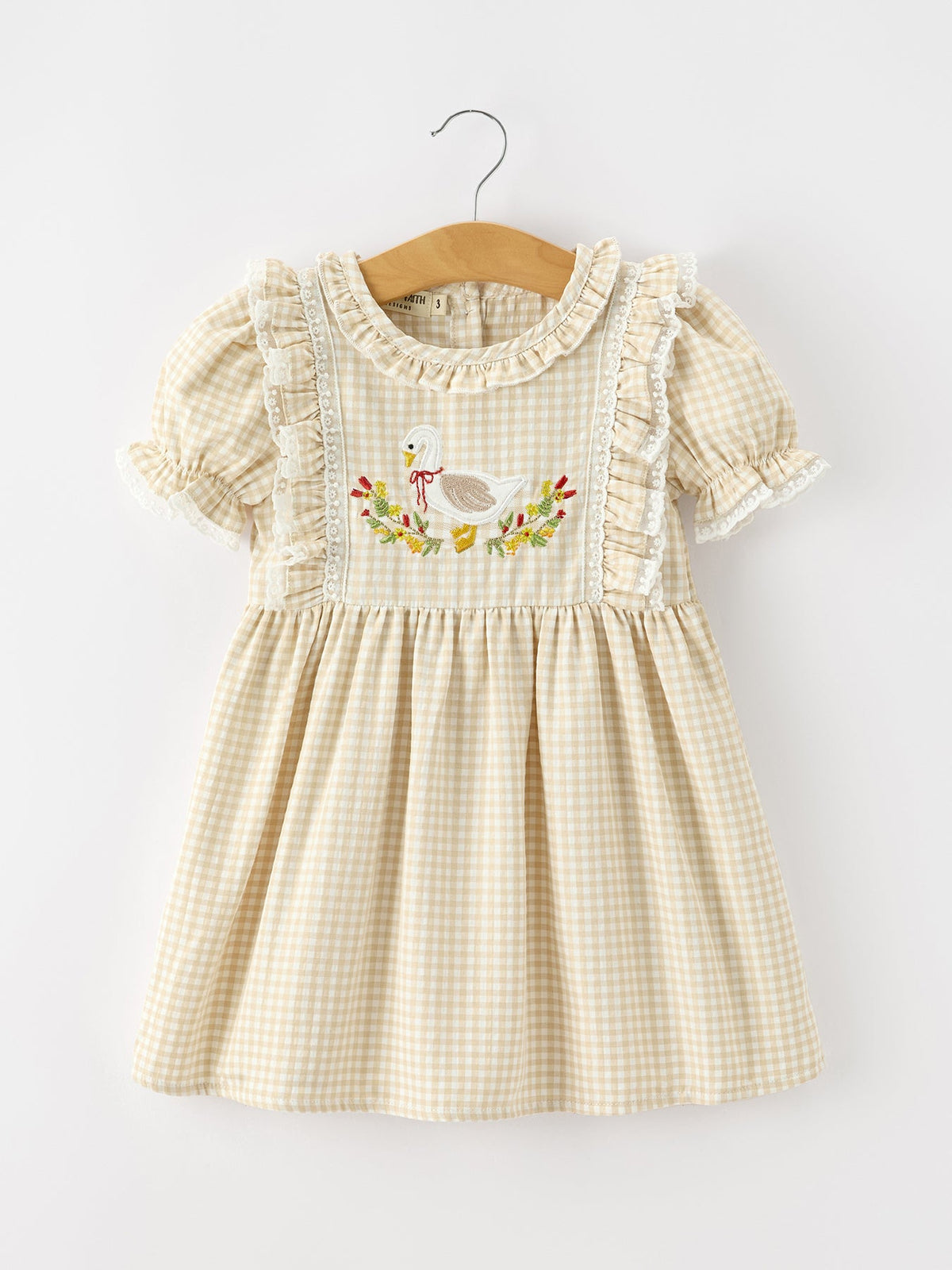 Girls beige plaid dress with ruffled sleeves and goose embroidery at chest
