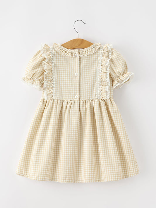 Girls beige plaid dress with button-back and ruffled shoulder detail