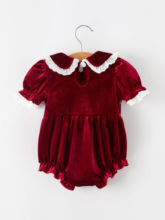 Burgundy velvet baby romper with white lace-trimmed collar and short bubble sleeves