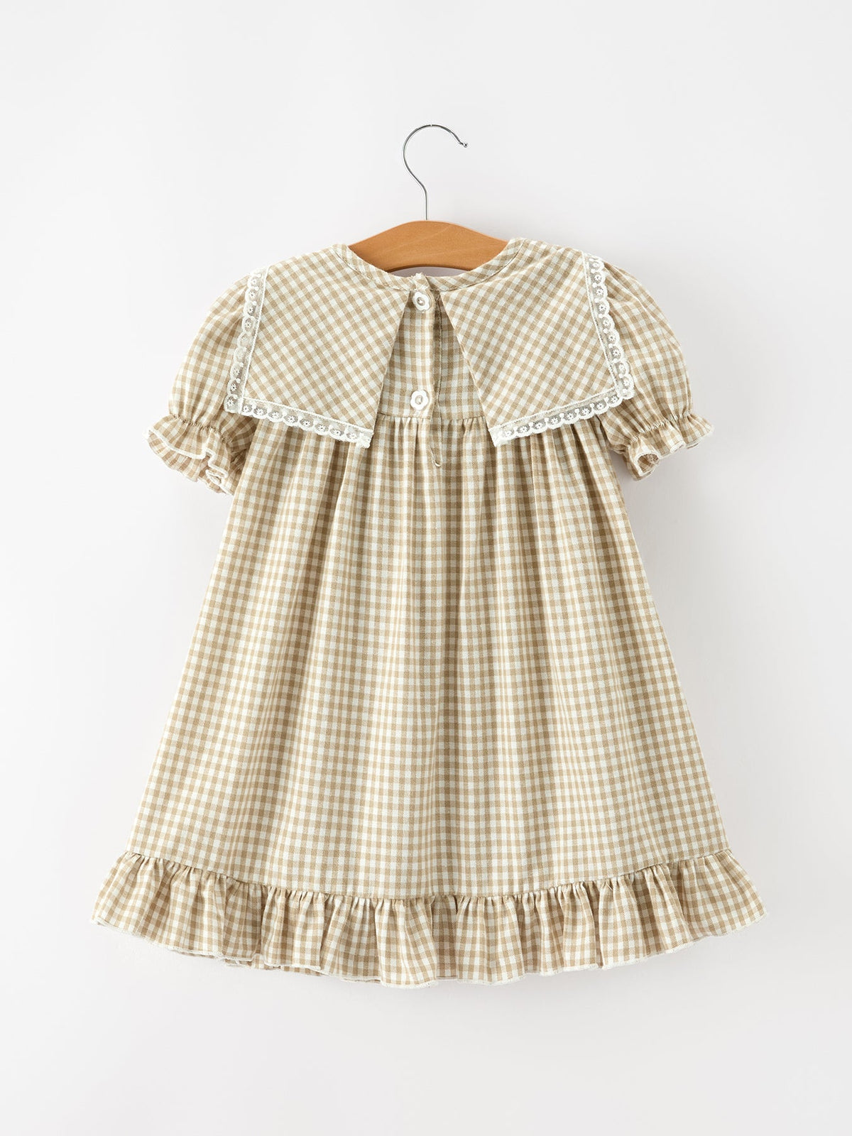 Girls gingham plaid dress with back yoke and button closure, ruffled hem