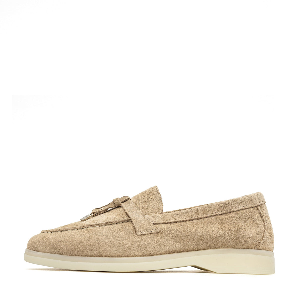 Beige suede loafer in side profile with apron stitching and cream sole