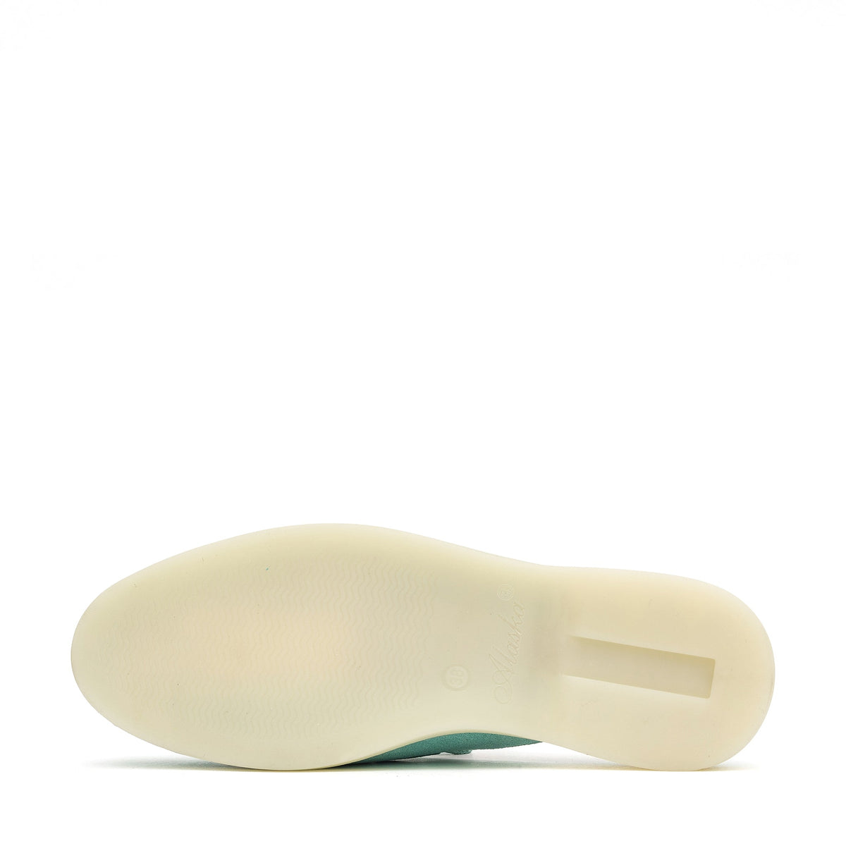 Mule with a cream-colored flat outsole shown from below