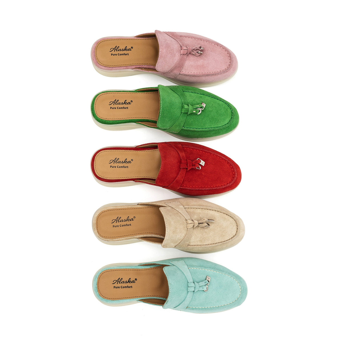 Red suede mule shown from above among other colors, with a moc toe and tassel.