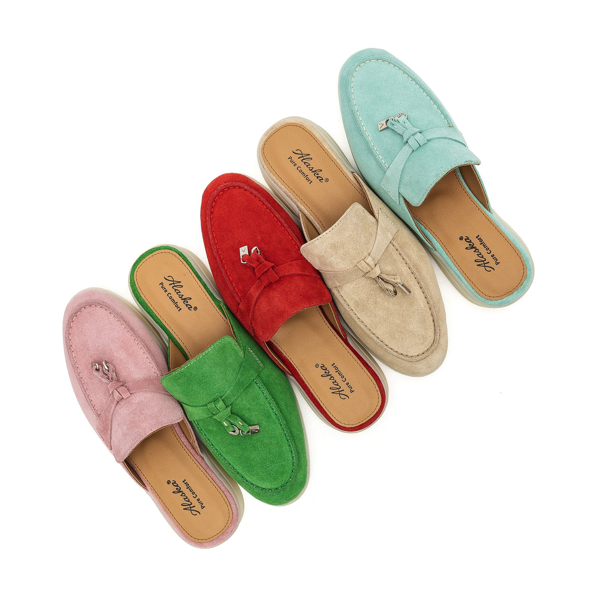 Red suede mule among assorted colors, with a moc toe and metal-accented tassel.