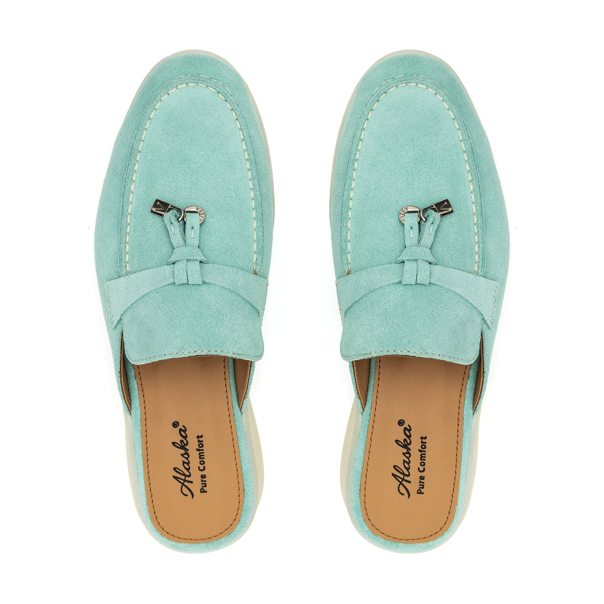 Turquoise suede mule pair with stitched moc toe and decorative metal tassels