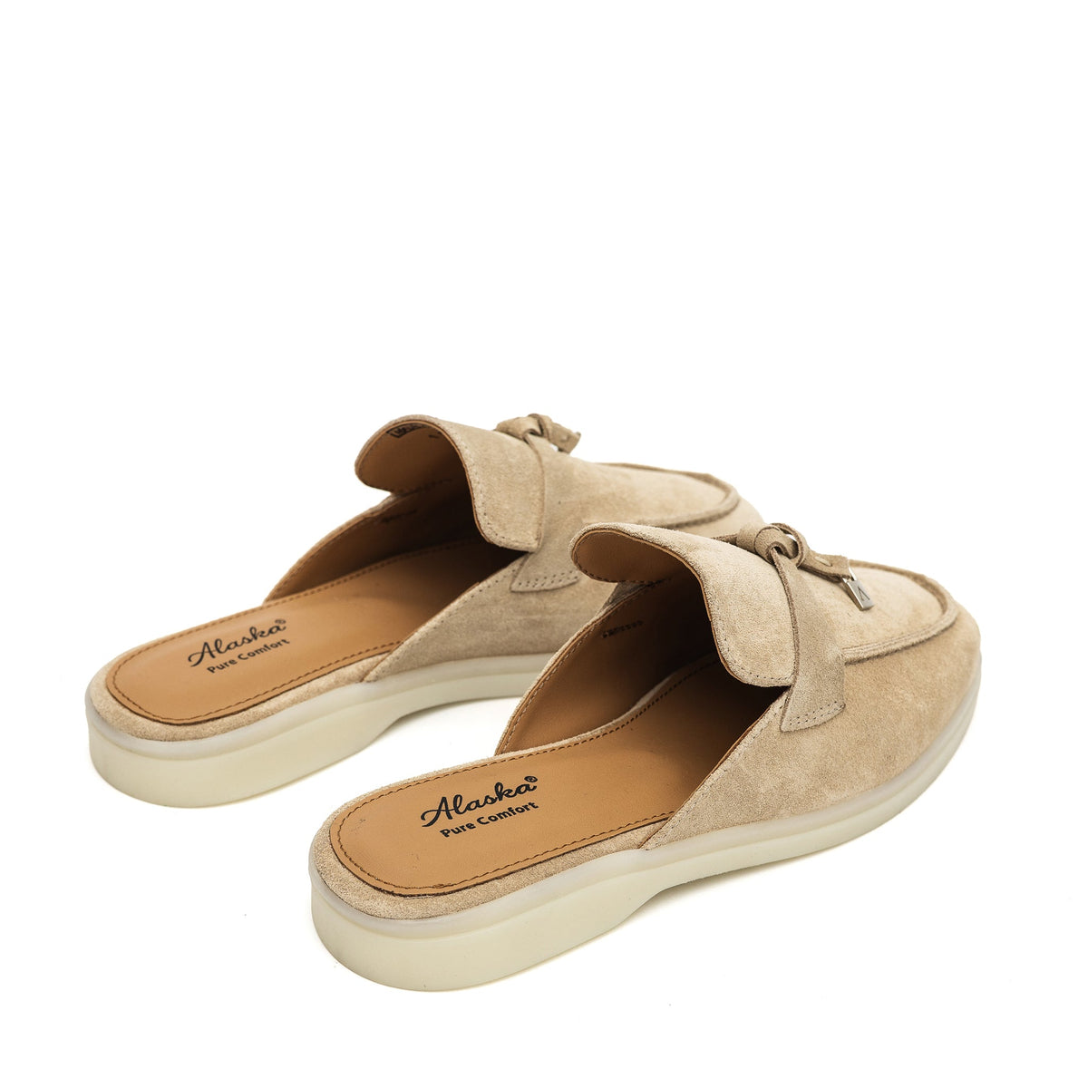 Rear view of beige suede mules showing open backs and tan insoles