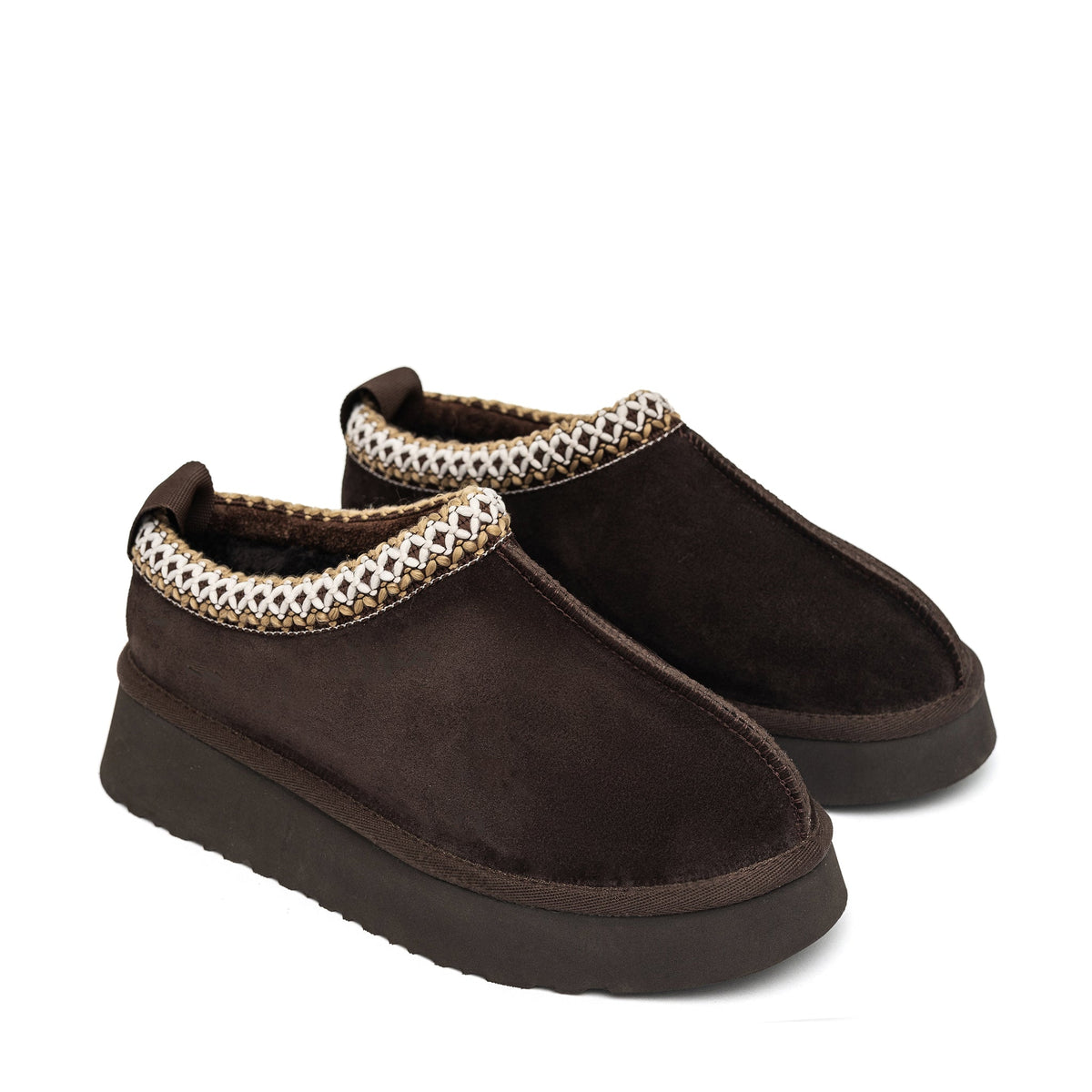 Brown shearling slippers with braided collar trim and thick rubber soles, side view