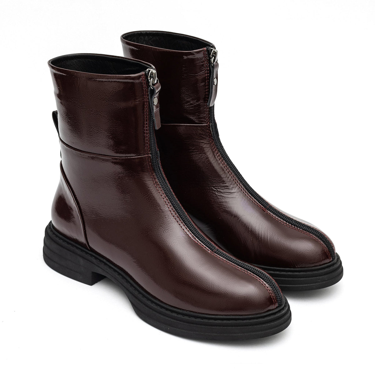 Burgundy leather zip boots with rounded toes and thick black soles