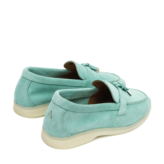 Turquoise suede loafers, shown from the rear and side with cream soles