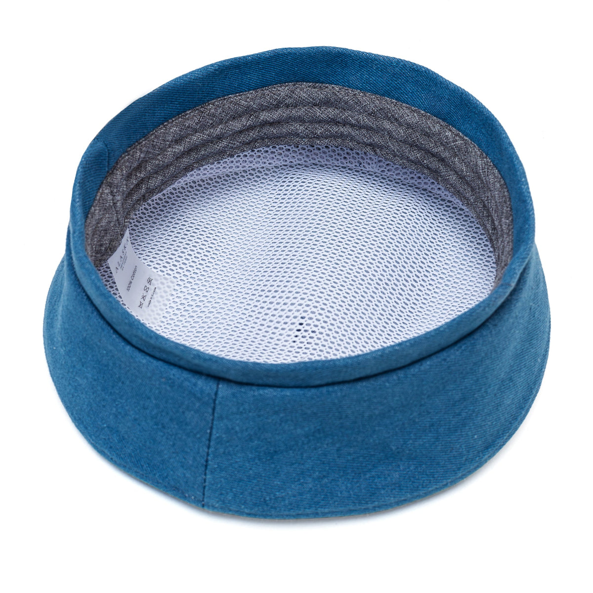 Blue Paris hat interior with mesh lining and a fabric-covered crown.