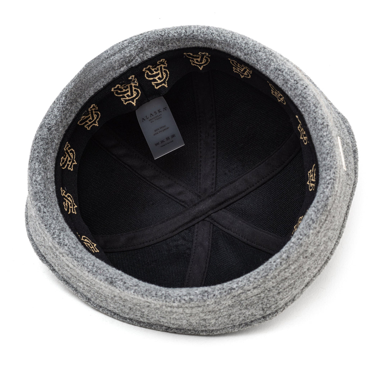 Light grey sailor hat with black inner lining and gold-tone trim motifs