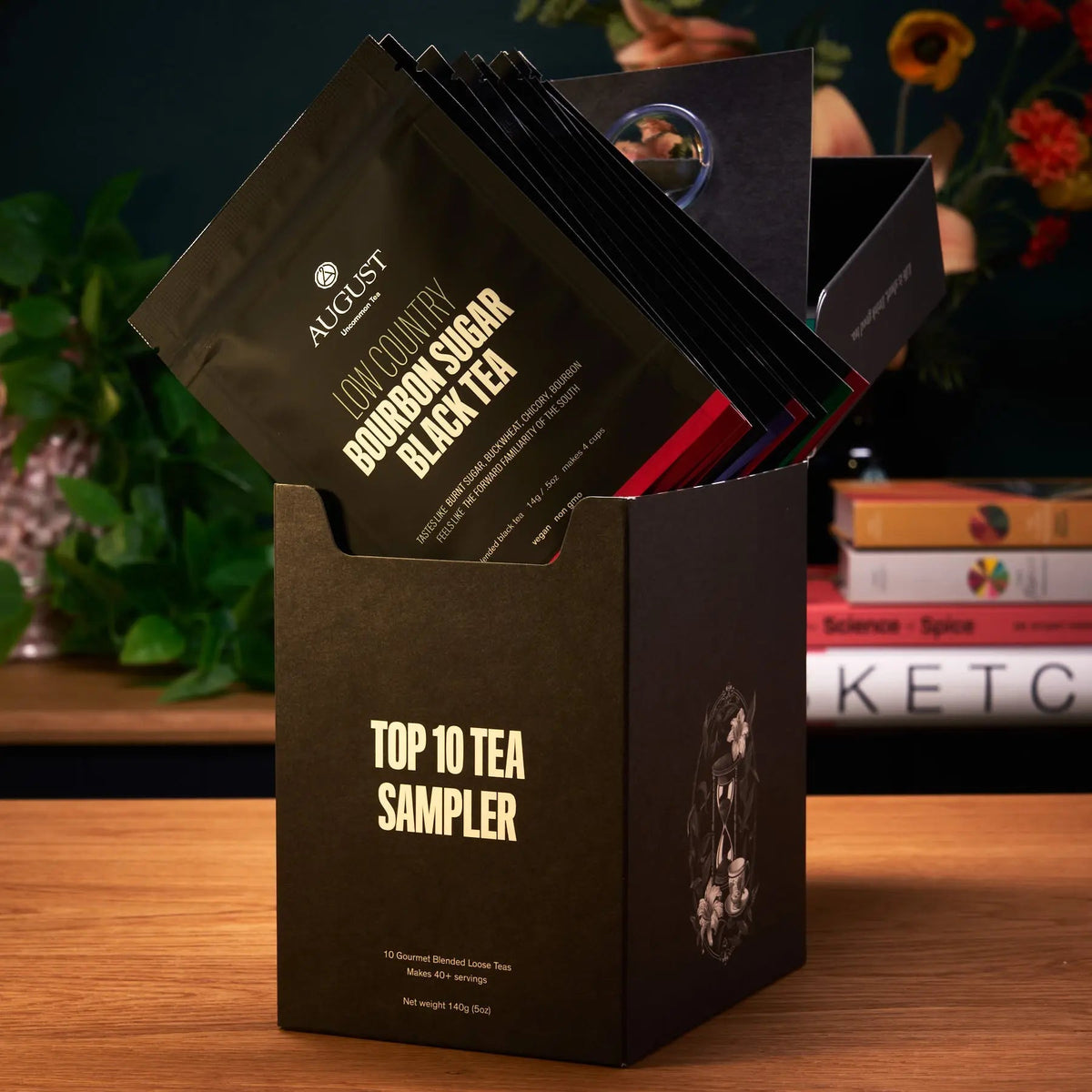 August Uncommon tea sampler box with assorted tea sachets, including bourbon sugar black tea