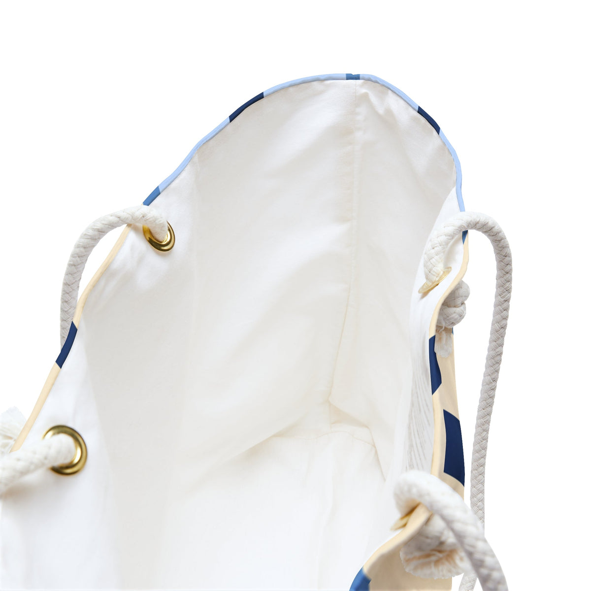 Oversized tote bag interior with white lining and knotted rope handles