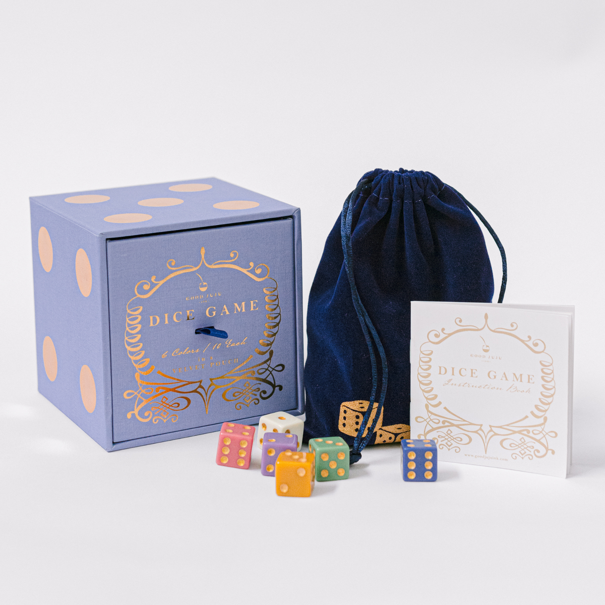 Dice set gift box with velvet drawstring pouch and colorful dice pieces.