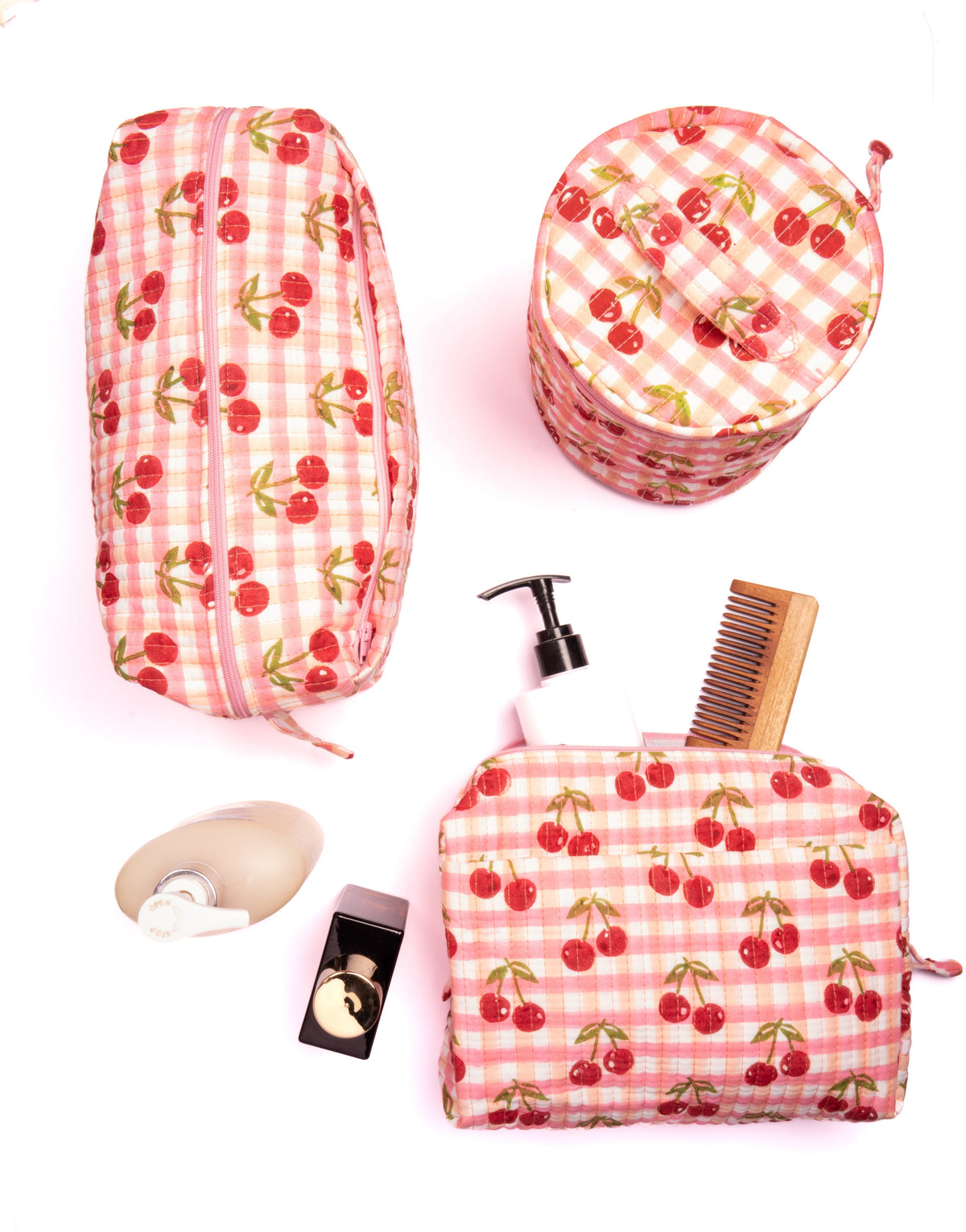 Upright round makeup bag with cherry-patterned red gingham fabric and zipper pouch
