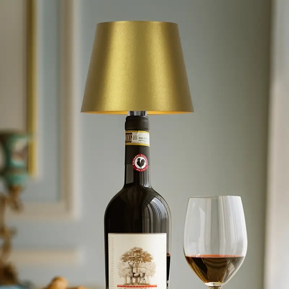 Bottle lamp with gold fabric shade and dark bottle body