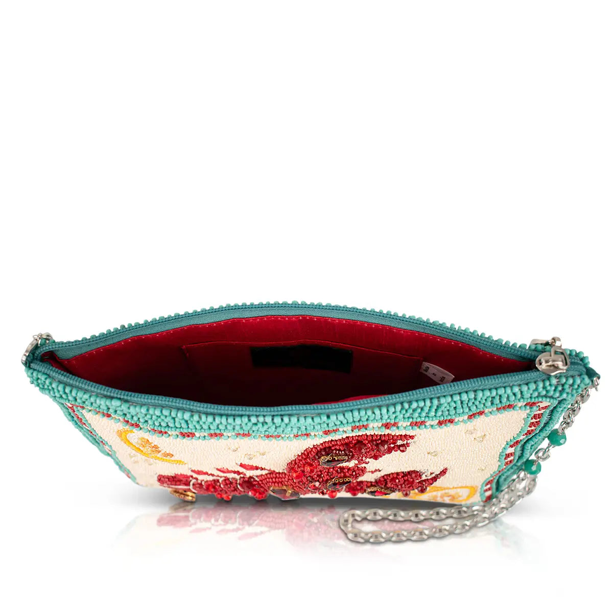 Beaded lobster handbag interior view with teal zipper top and red fabric lining