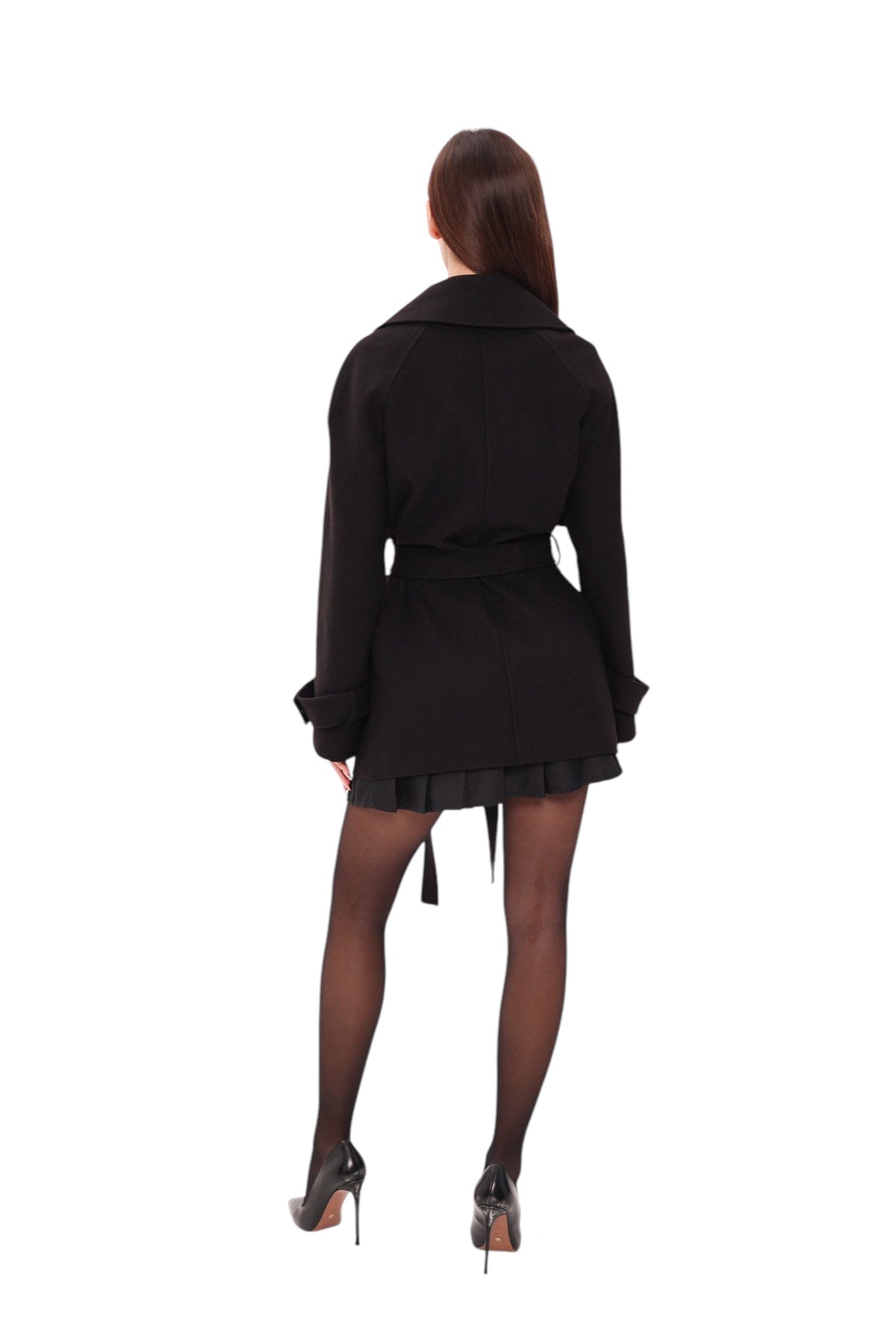 Back view of the black belted coat with a flared hem and button-tab cuffs.