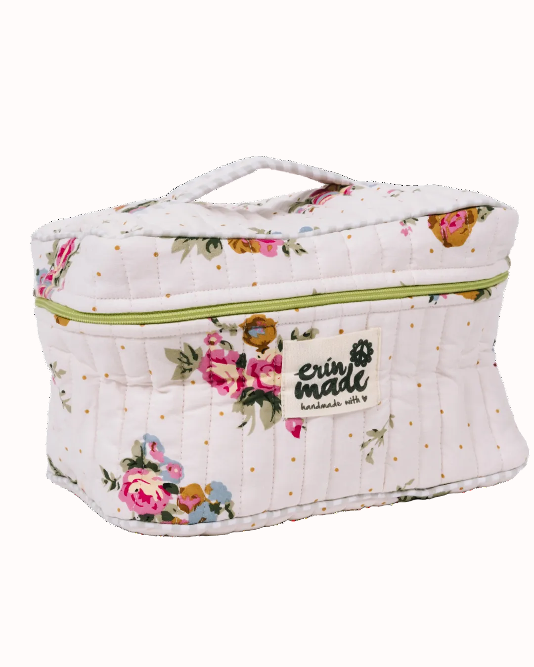 Quilted travel case in white with colorful floral print and lime zipper, top handle