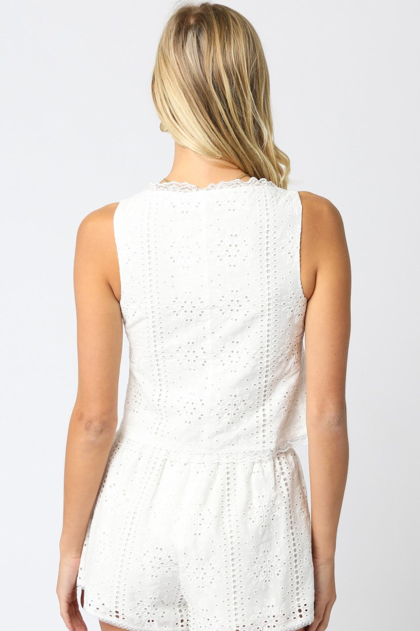 White eyelet tank top, back view, scalloped trim and peplum hem