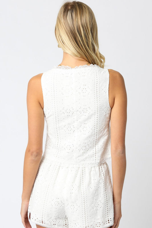 White eyelet tank top, back view, scalloped trim and peplum hem