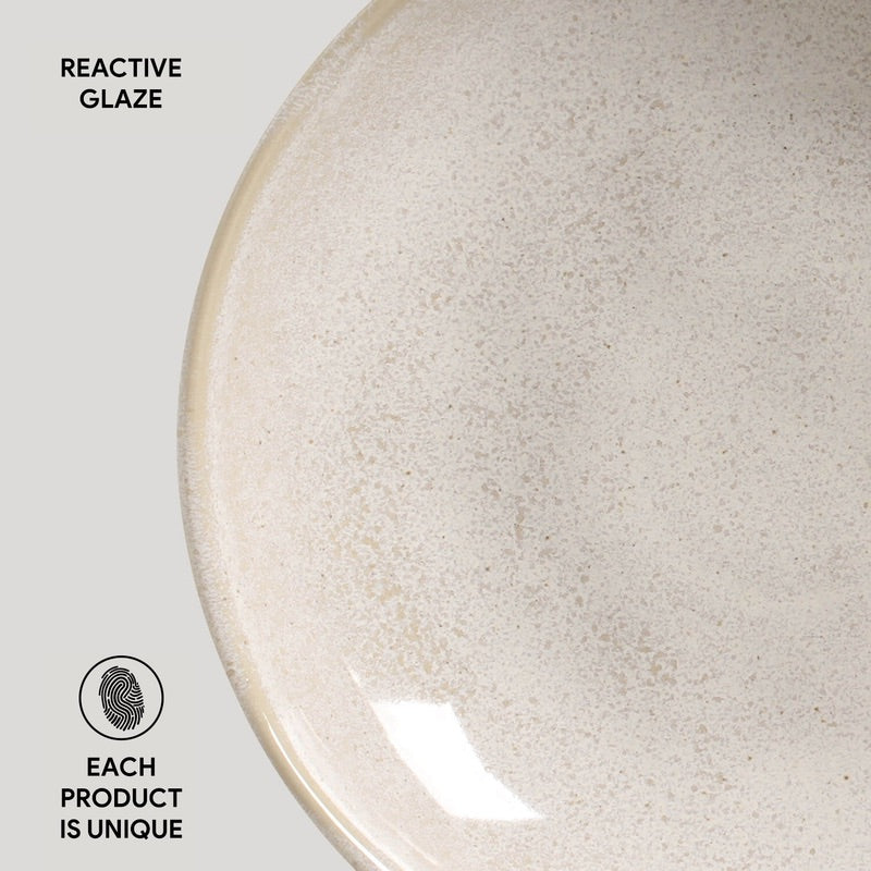 Light beige speckled ceramic pasta plate with glossy reactive glaze