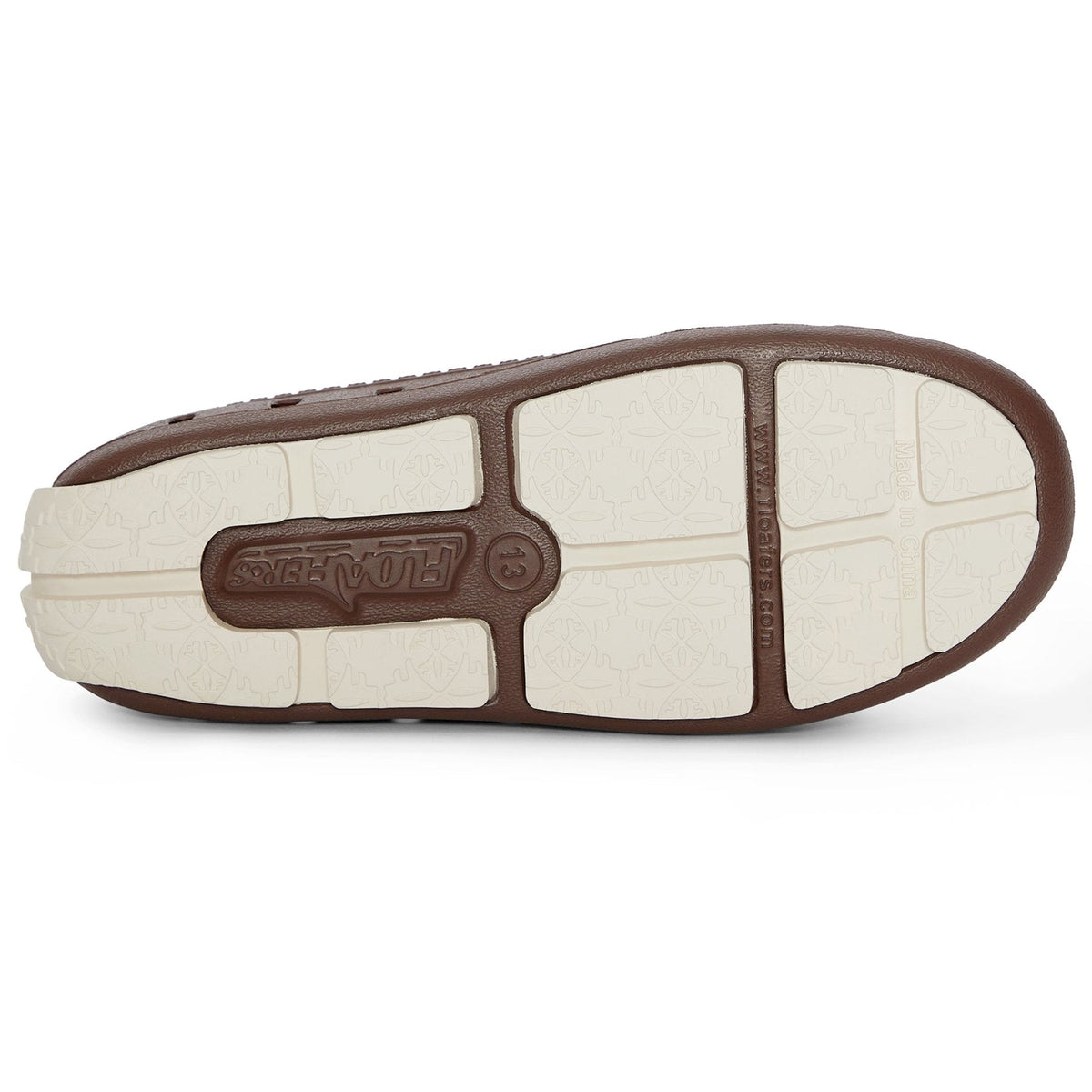 Kids brown loafer outsole with beige tread segments and embossed center logo