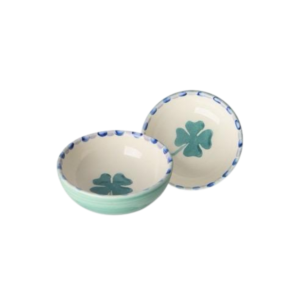 Small ceramic dipping bowls with green clover designs and blue-speckled rims