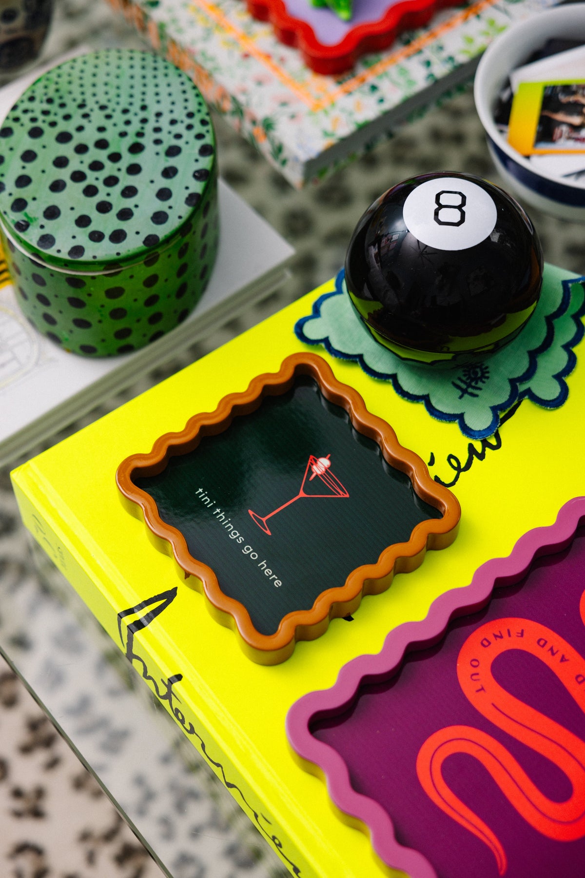 Scalloped orange-rim lacquer tray with dark green panel, martini graphic and “tini things go here”