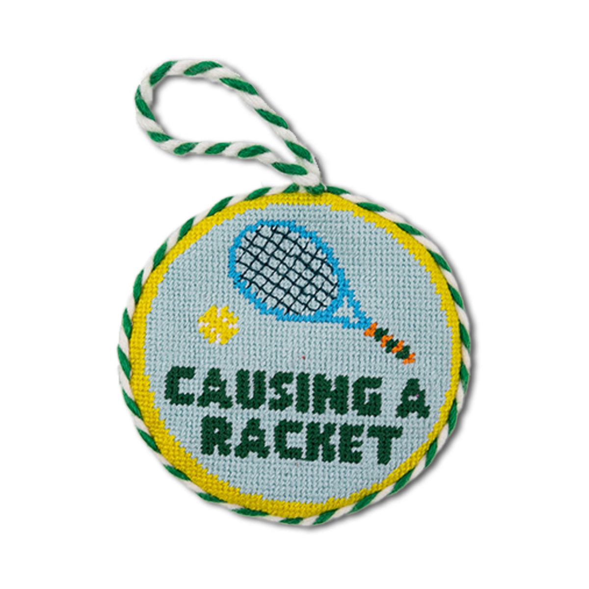 Round needlepoint Christmas ornament with blue bird motif and green-striped hanging loop