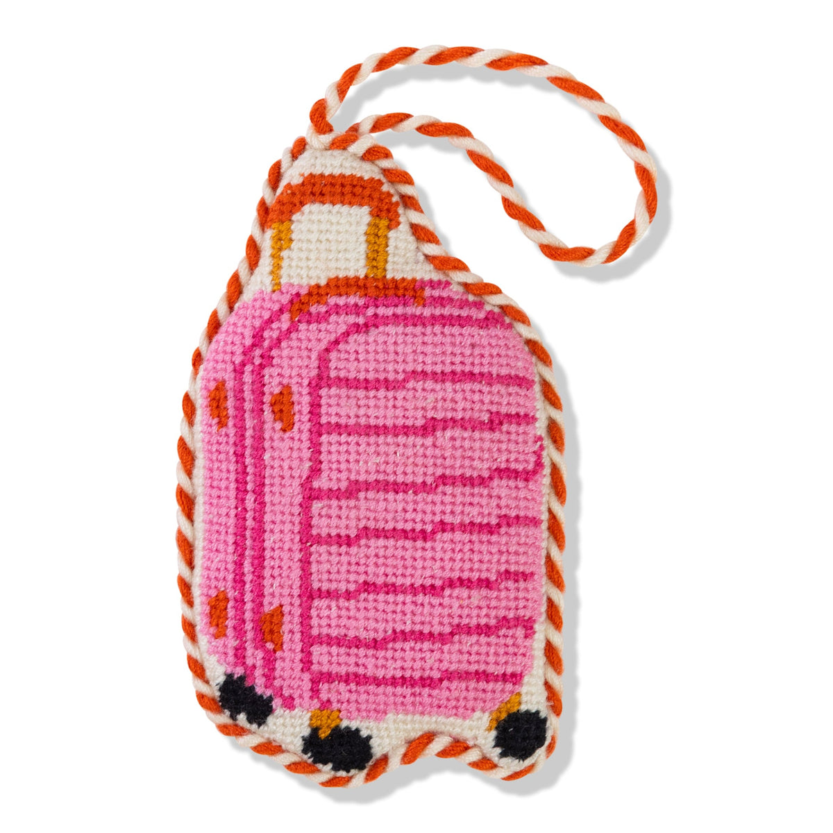 Luggage-shaped needlepoint ornament with pink body, orange trim, and white braided cord loop