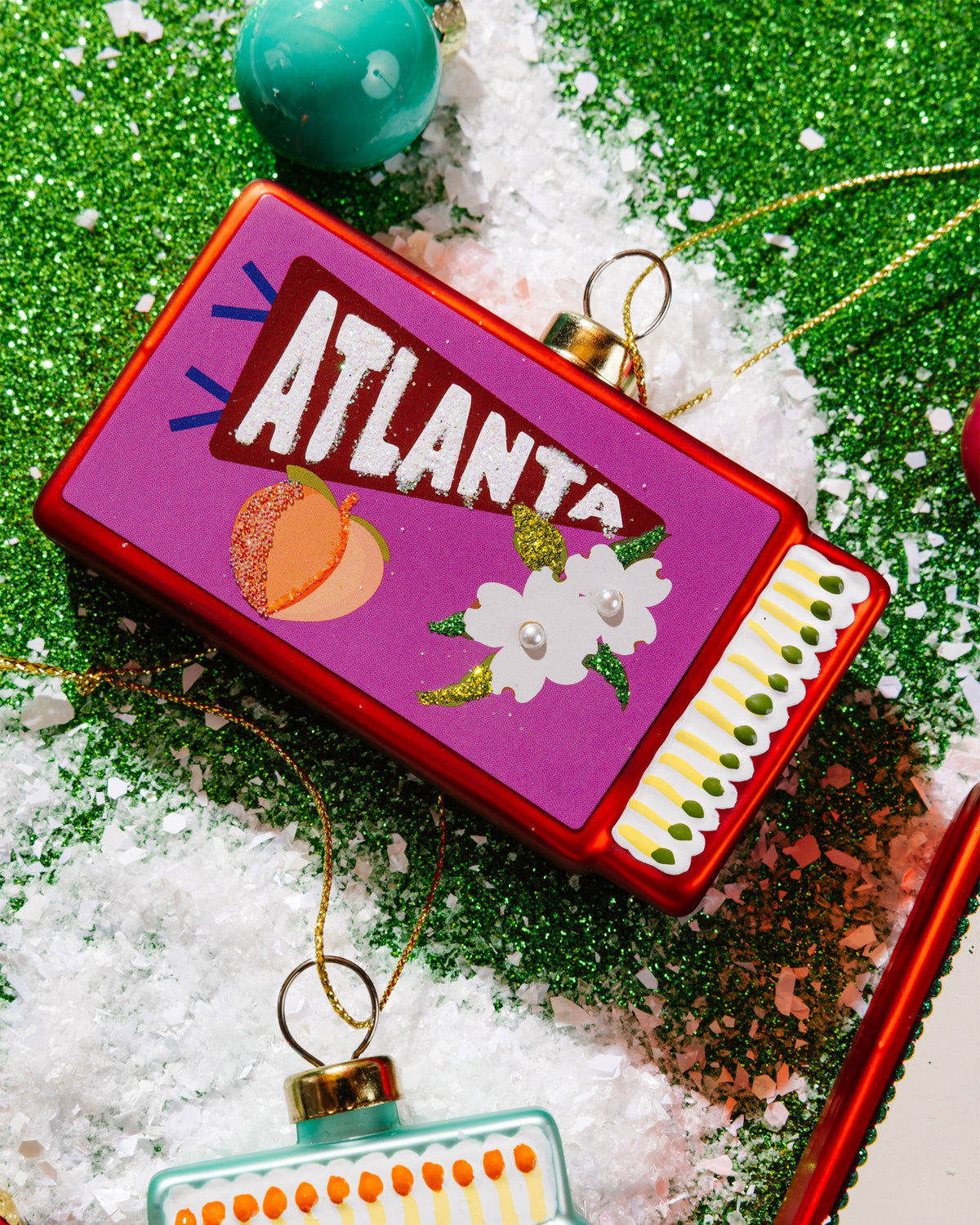 Atlanta matchbook ornament with gold top ring and red frame