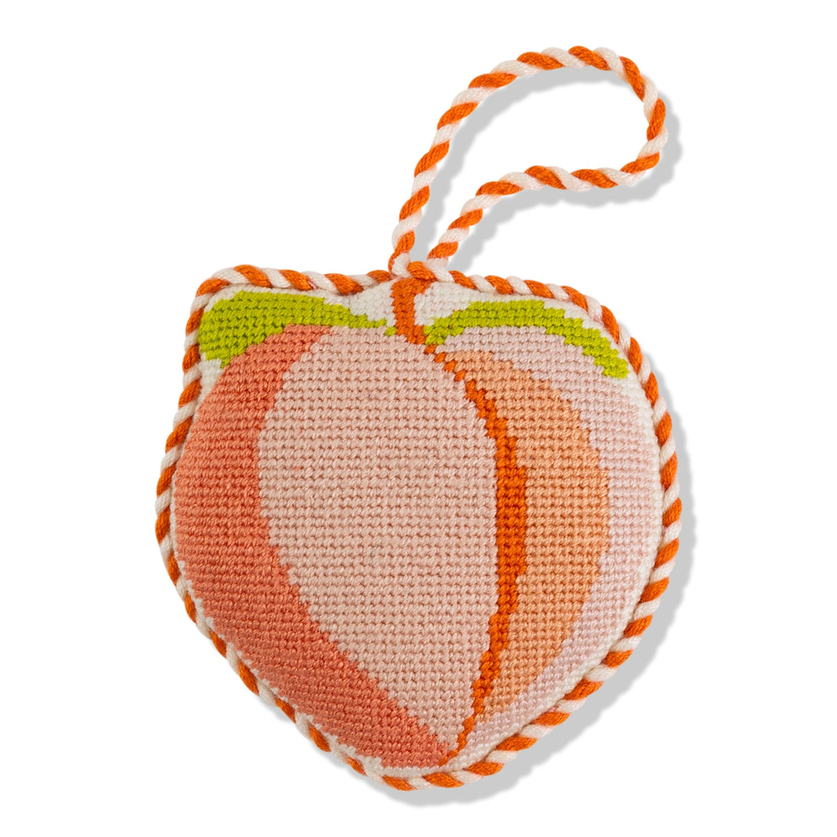 Peach needlepoint heart ornament with striped loop hanger and orange stitch edging