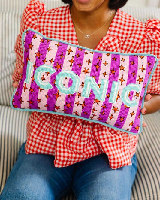 Needlepoint lumbar pillow with purple front, teal letters, and star-and-cross motifs