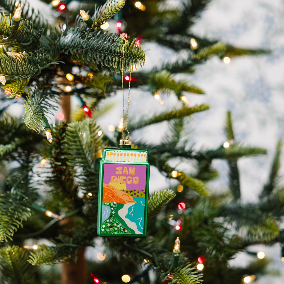 Green matchbook ornament shaped like a matchbook with 'SAN DIEGO' text