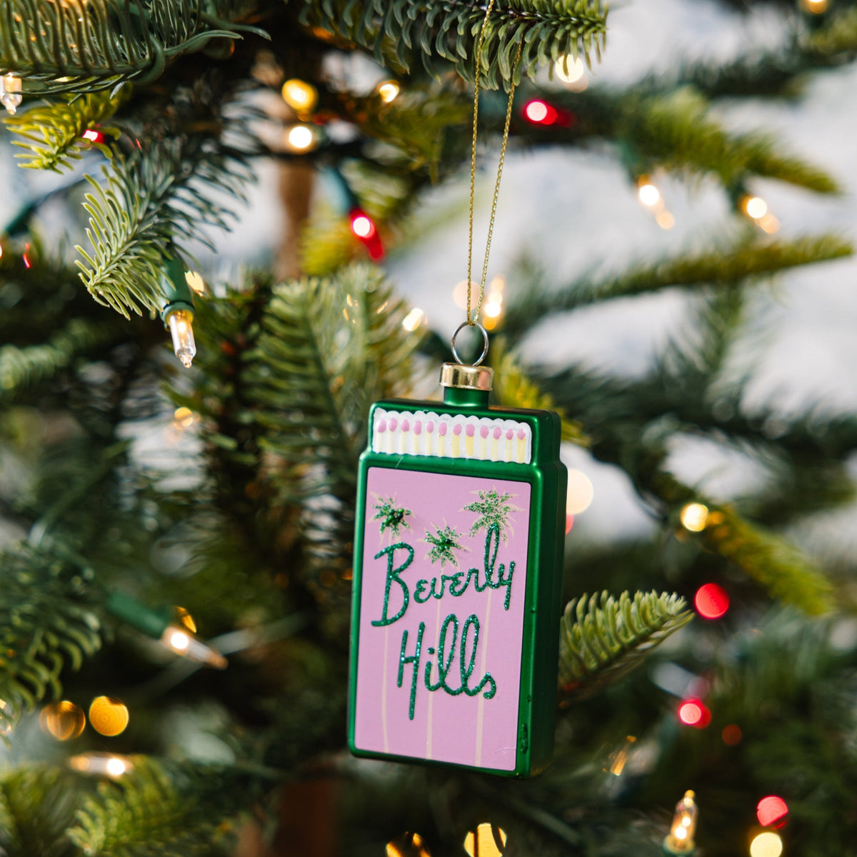 Matchbook ornament with green border and 'Beverly Hills' lettering, gold hanging loop