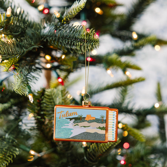 Hanging Tulum matchbook ornament with orange border and glitter beach illustration