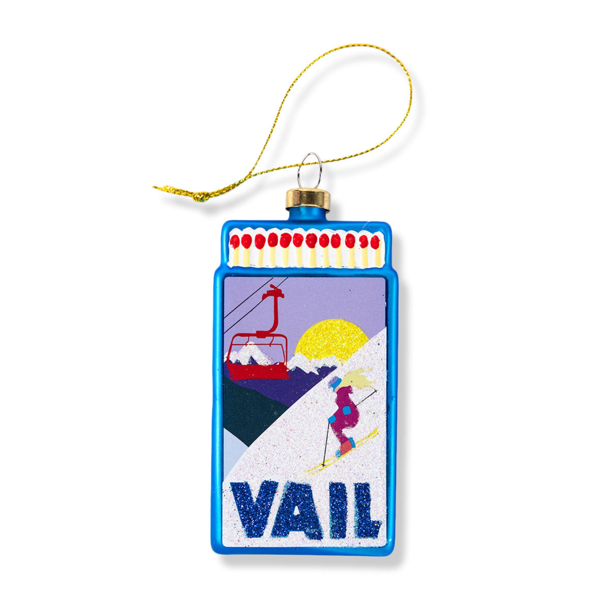Blue matchbook-style ornament with gold loop, VAIL design and ski scene on front.