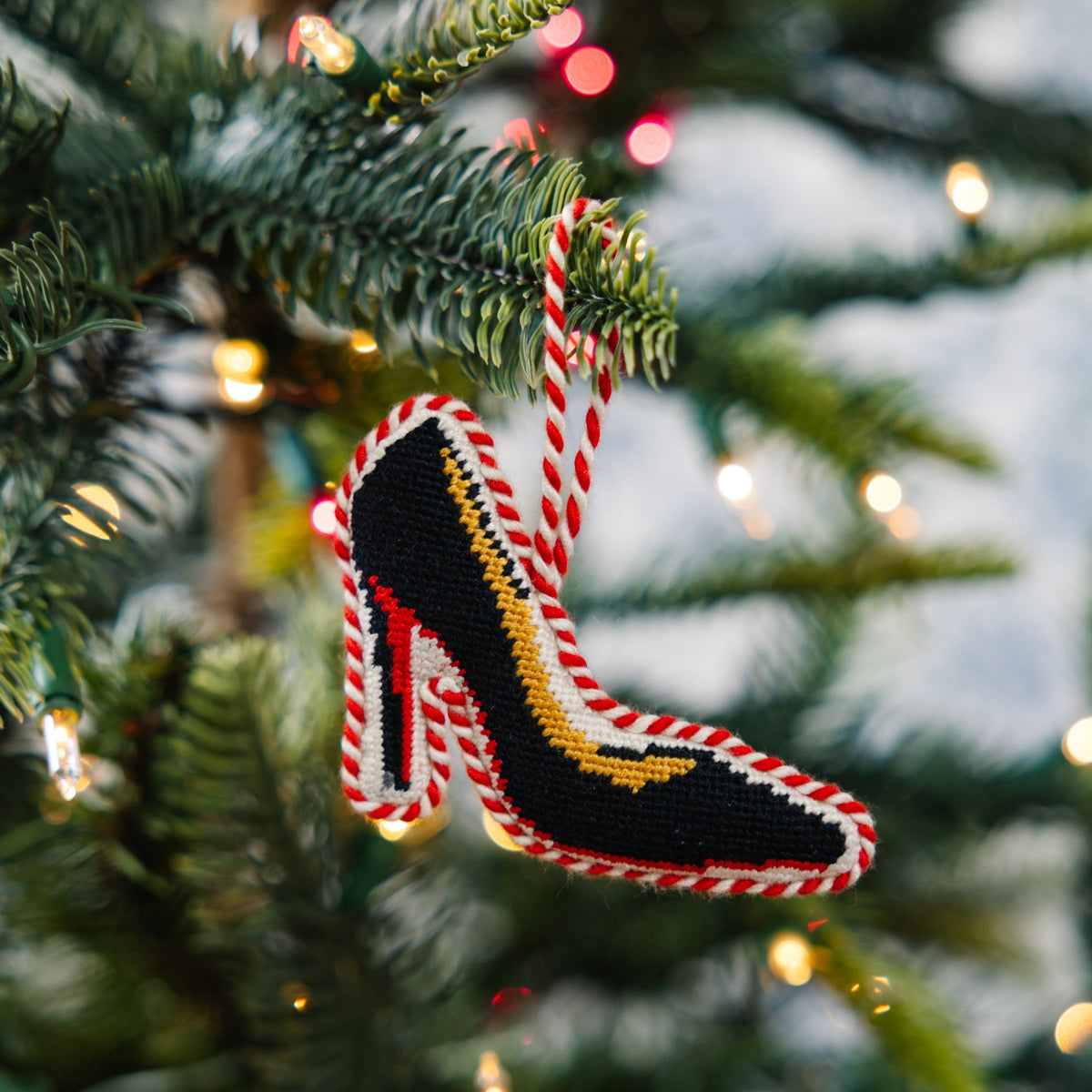 Needlepoint high heel ornament hanging from ribbon, red/yellow/black stitched