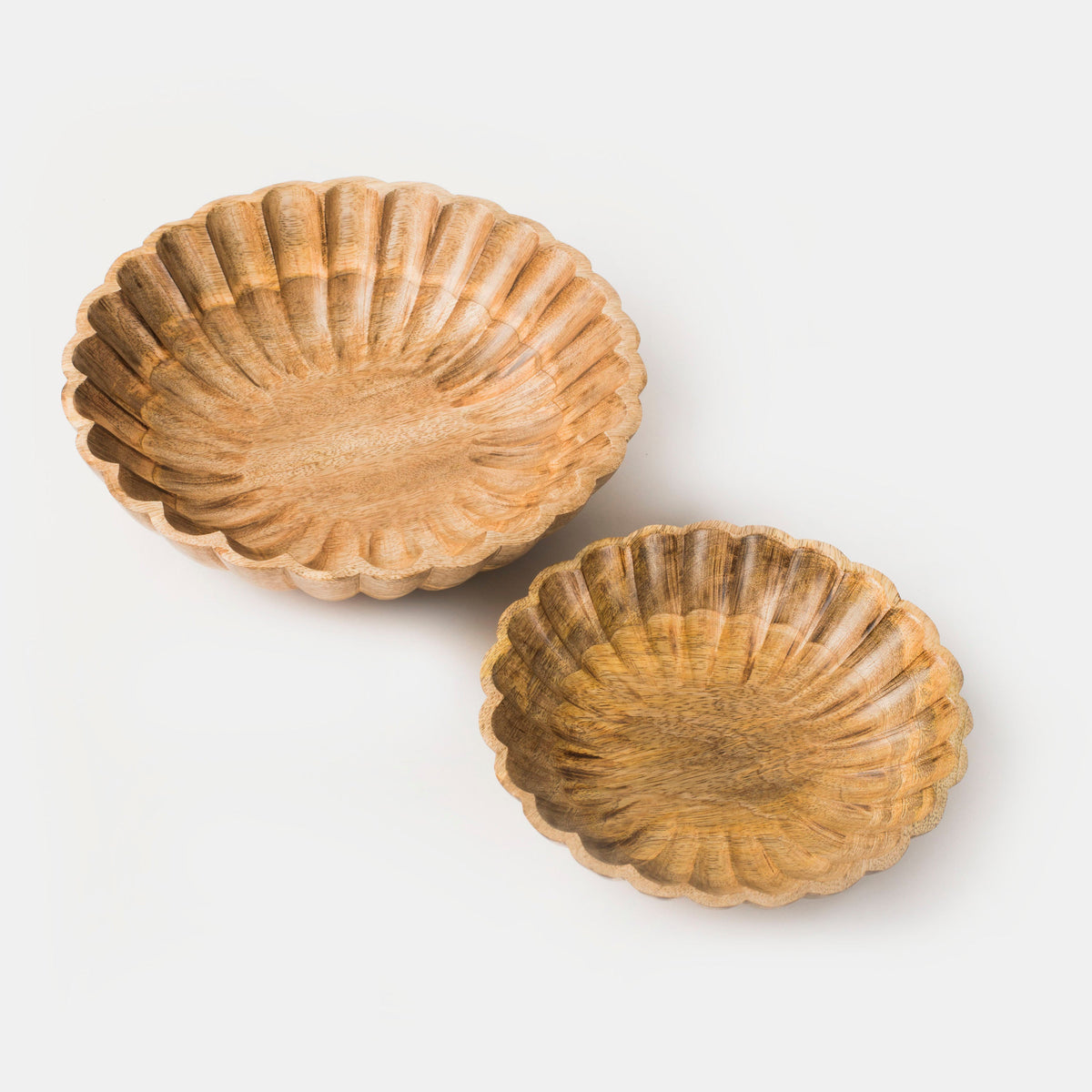 Pair of scalloped natural wood bowls with ridged shell pattern